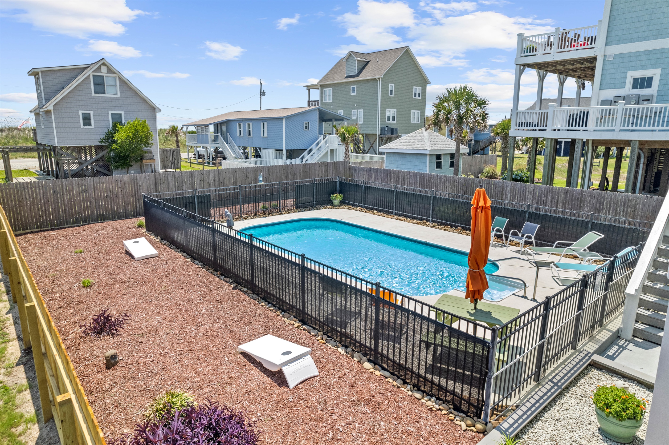 Fenced in Yard with Cornhole