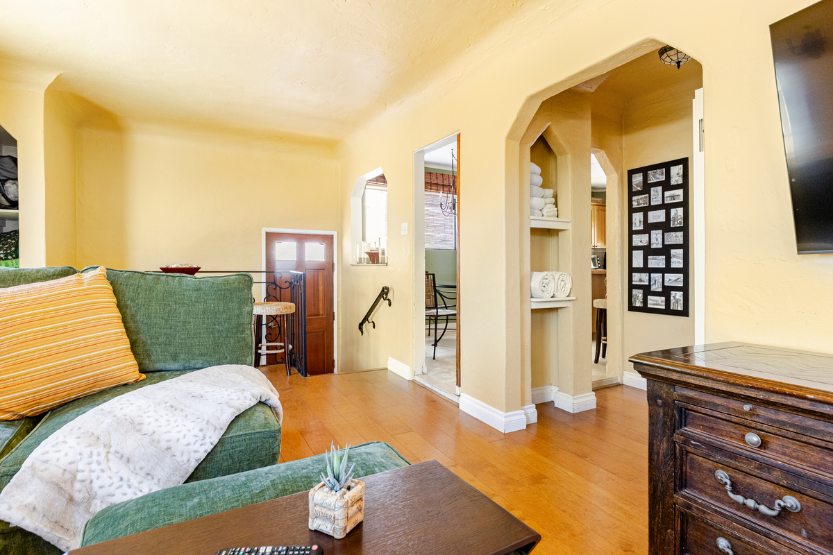 Living room includes a comfortable Lovesac sectional, hardwood floors, gas fireplace and an ocean view.  Open all the windows and enjoy the sound of the waves crashing on the beach.
