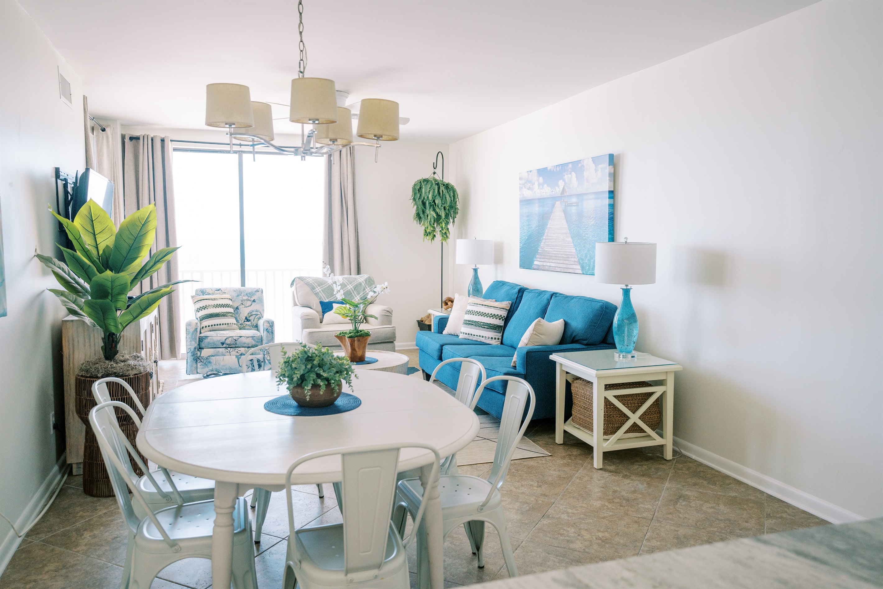 Open living space with comfortable seating and easy access to the beachfront balcony.