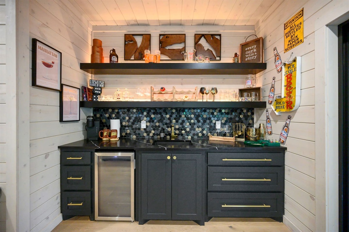 The wet bar in the game room comes with a ton of barware, wine, beer and whiskey glasses.  A second keurig machine plus a beverage fridge for keeping drinks ice cold.