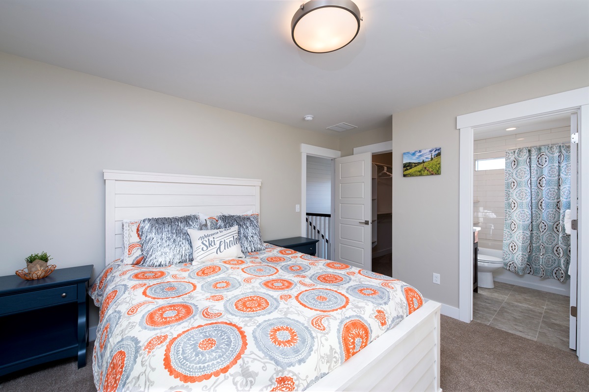 Bright and comfortable ensuite bedroom with peaceful surroundings