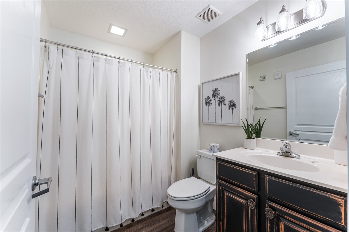 Guest Bath located next to guest bedroom & kitchen.