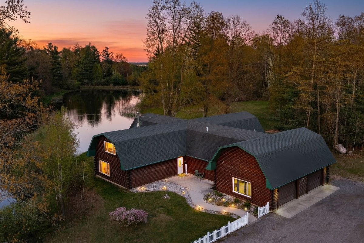 Aerial view of our home and pond.