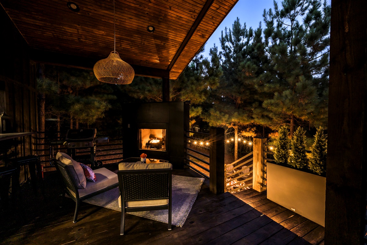 🔥“Evenings by the fire just hit different here — relax on the deck, wrapped in nature and soft, golden light.”