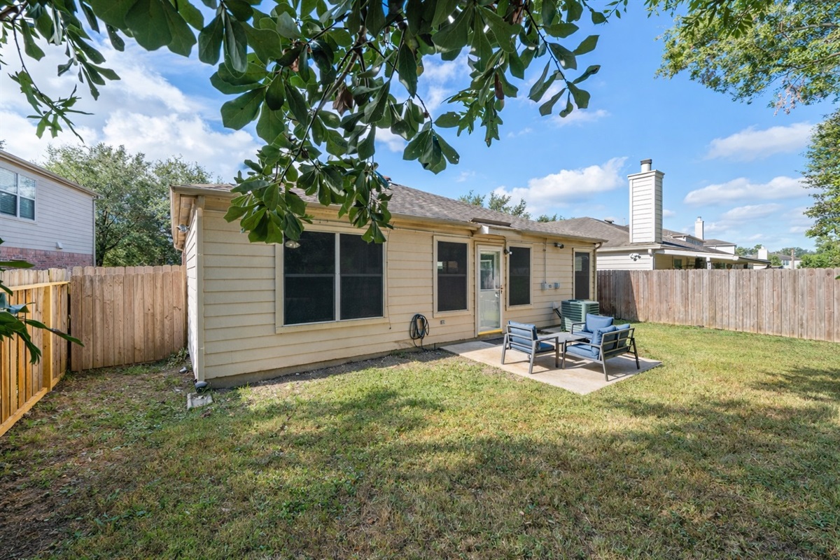 Spacious outdoor area for BBQs, games, and relaxation.