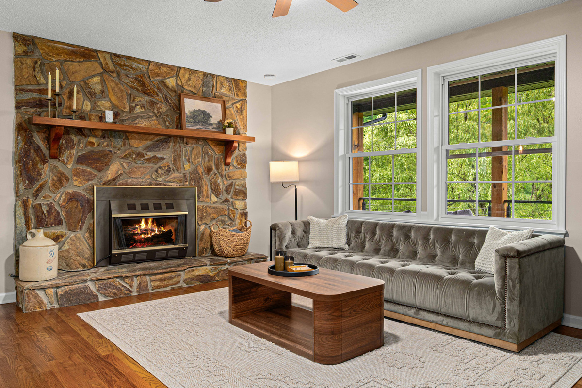 Living Room: Unwind by the fire as natural light dances through spacious windows!