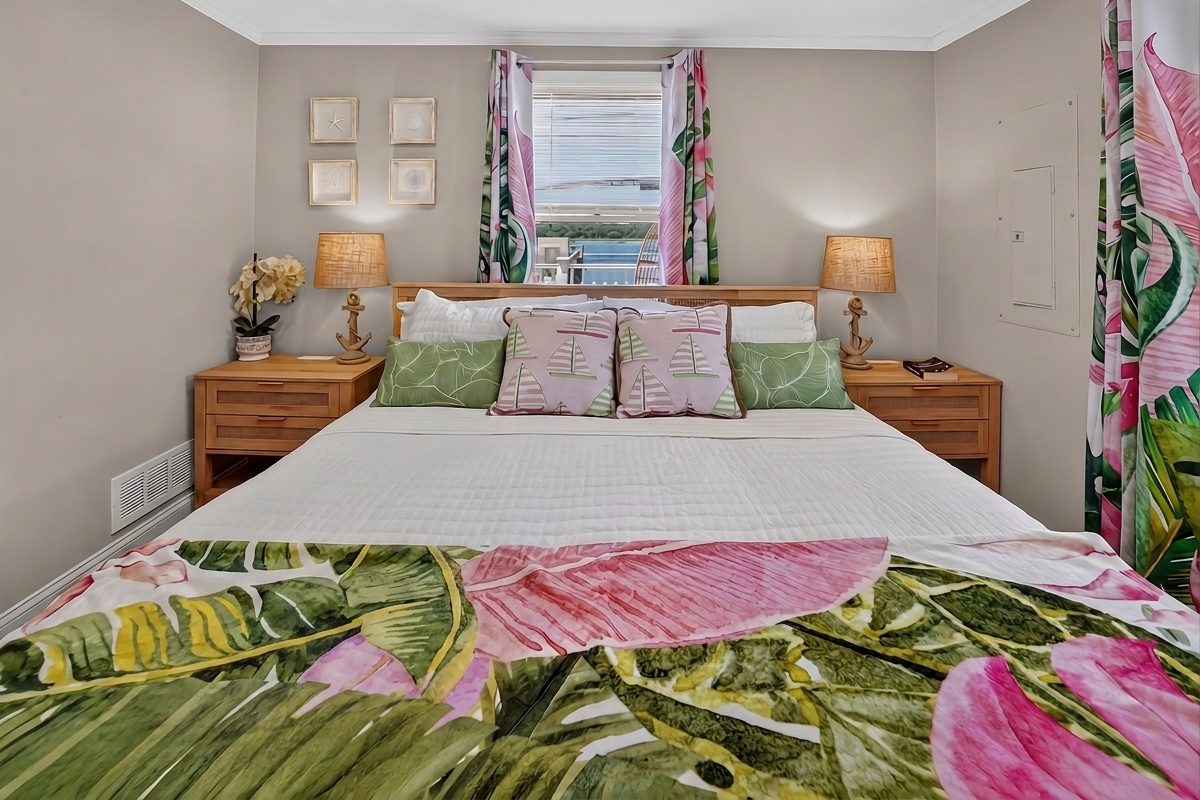 Stretch out and relax in a spacious bed surrounded by bright tropical accents.