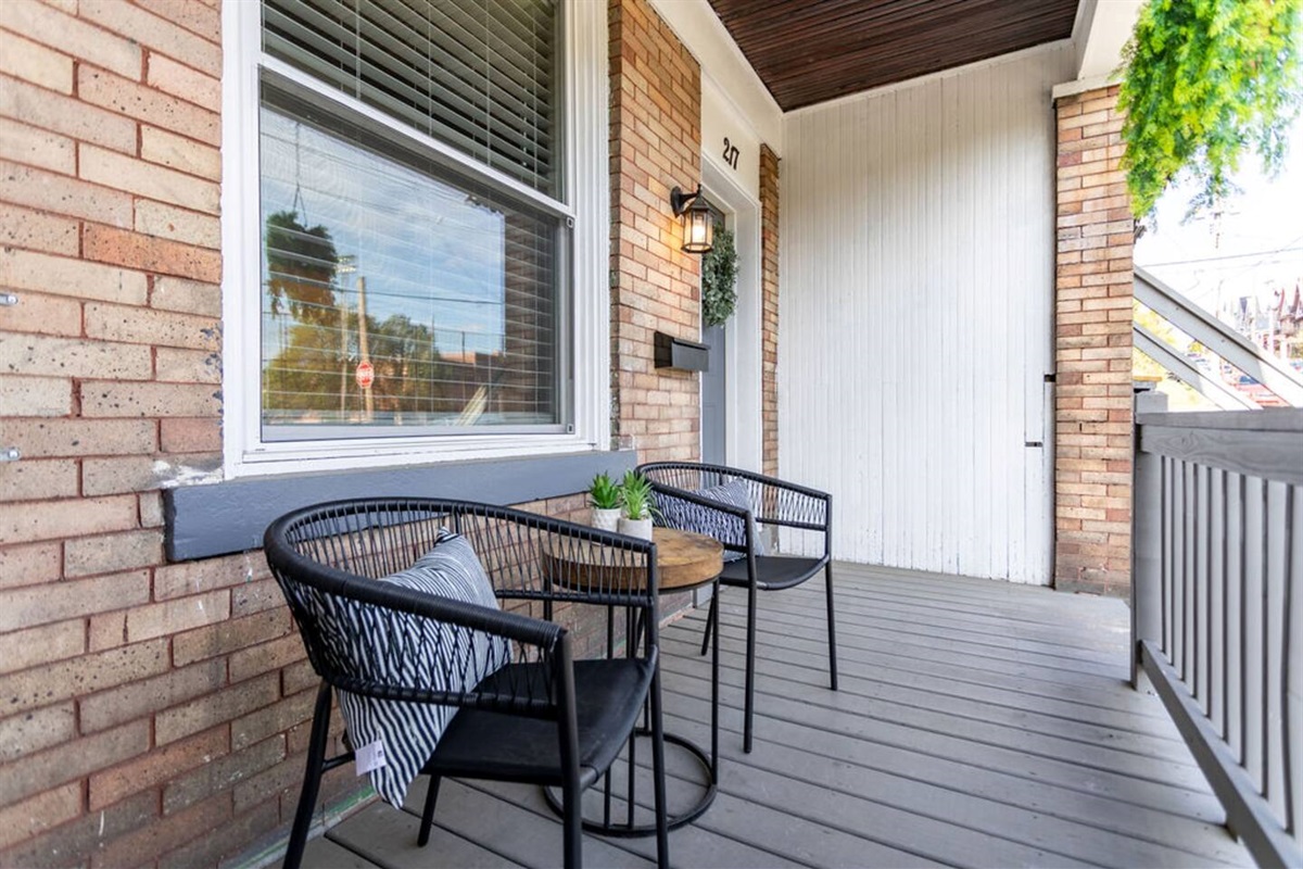 Relax and unwind on the comfortable patio seating, perfect for enjoying the outdoors.