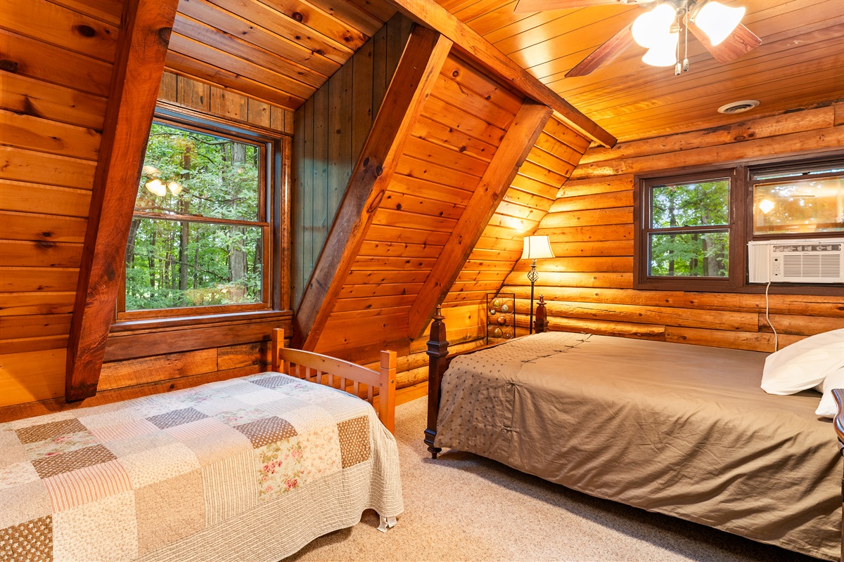 Bedroom #3 Cozy cabin-style bedroom with queen and twin and direct access to the hallway for added convenience.