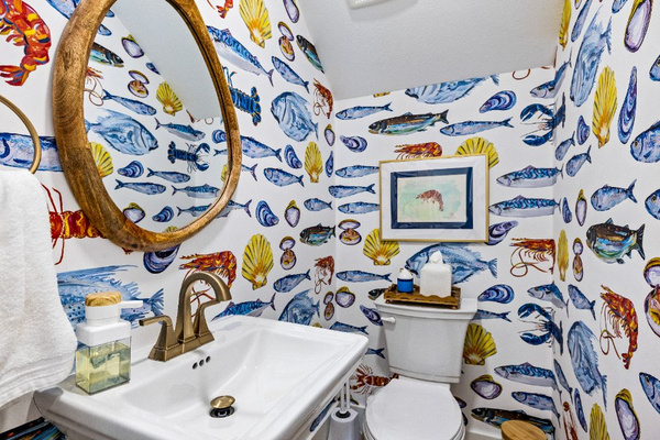 The main floor half bath is convenient for everyone! You'll feel like you are swimming in the ocean!