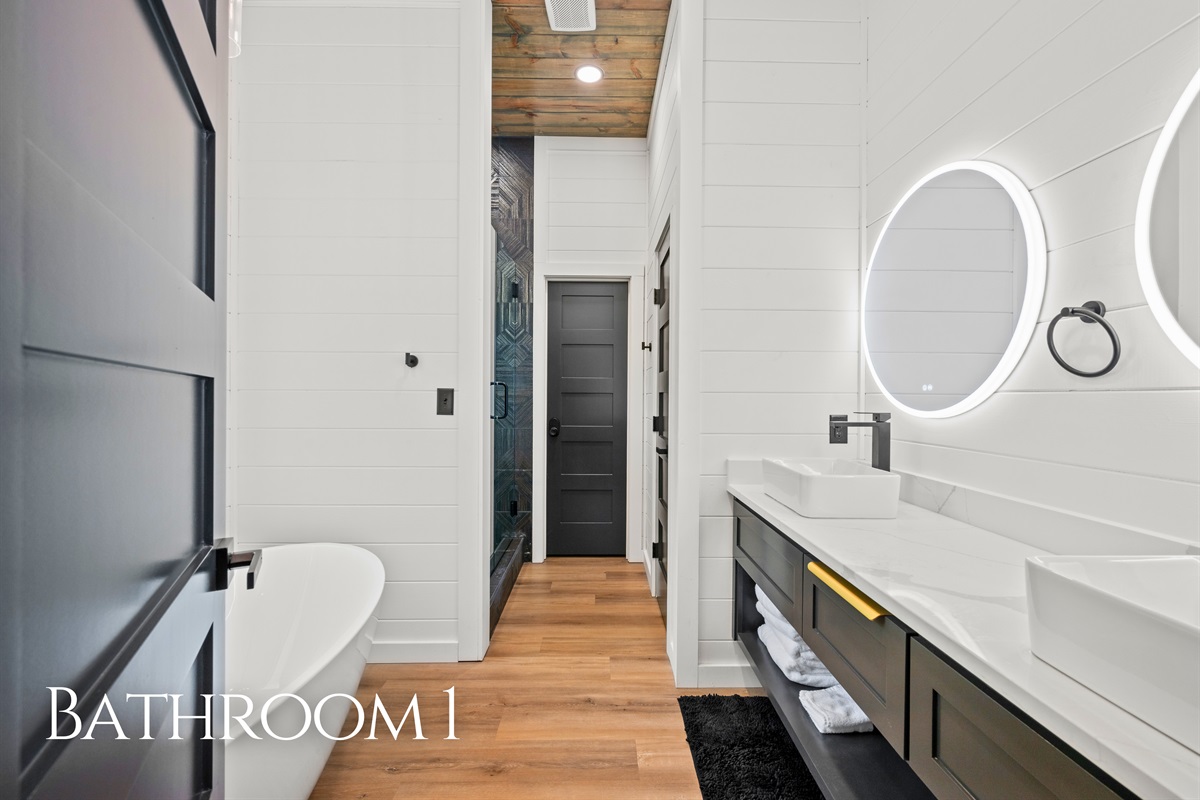 The spacious bathroom features modern fixtures, clean lines, and a calming atmosphere that makes it easy to relax and refresh during your stay.