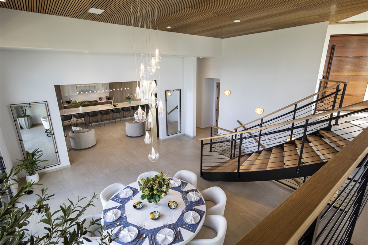 Dining table and kitchen view from the upper living room level 