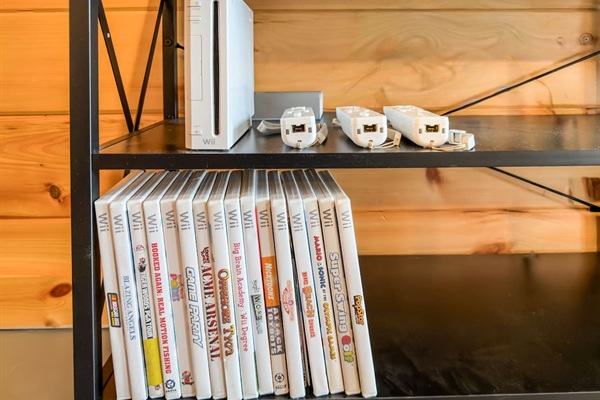 Movie room right off the game room includes big screen smart TV with streaming available, DVD player, and Wii video games!