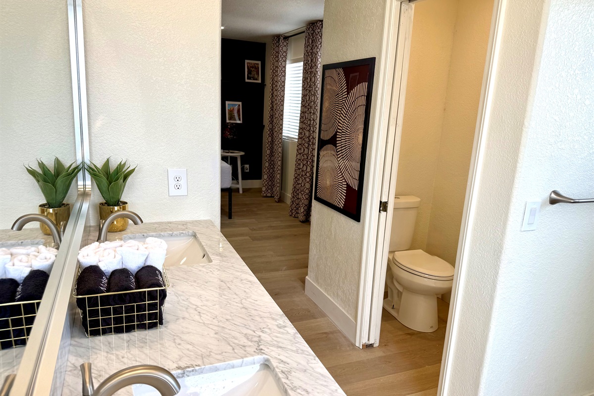 Large main ensuite bathroom has separate shower & soaking tub; double sink vanity; & separate water closet. Hair dryer & shower toiletries provided.set.