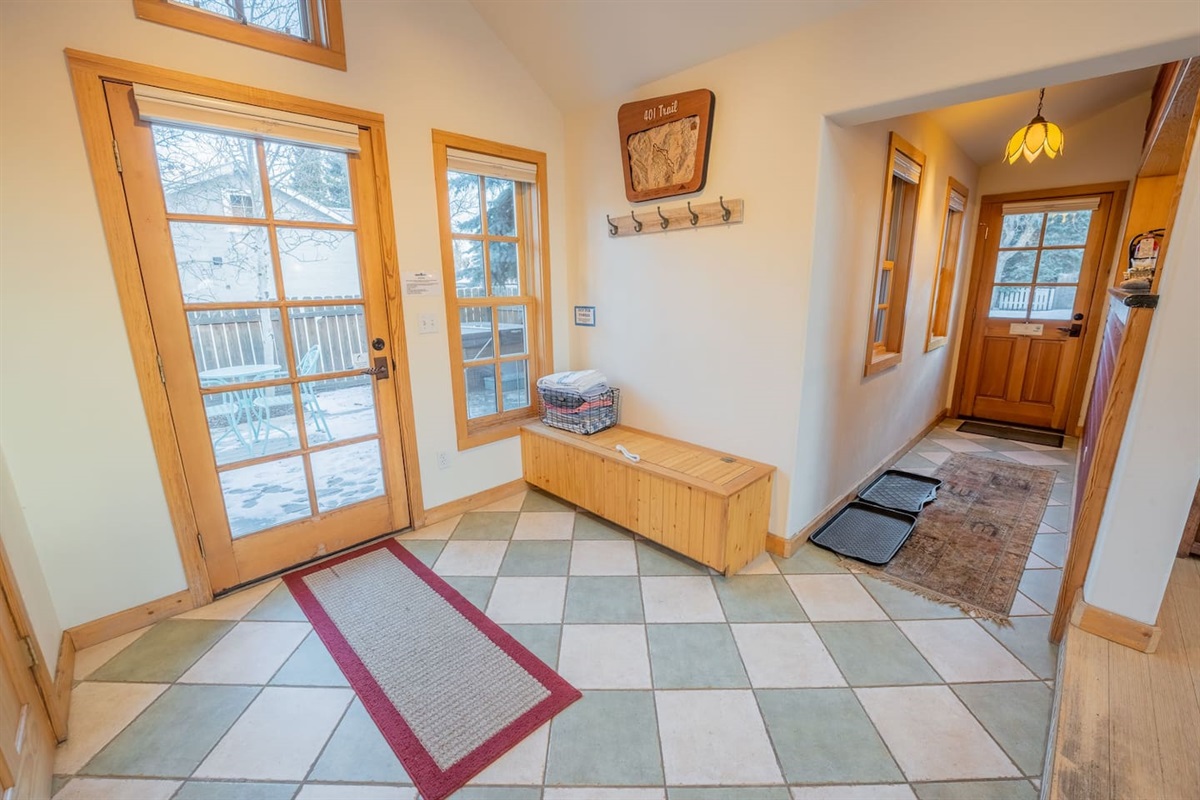 Entryway and backyard/hot tub/grill access.