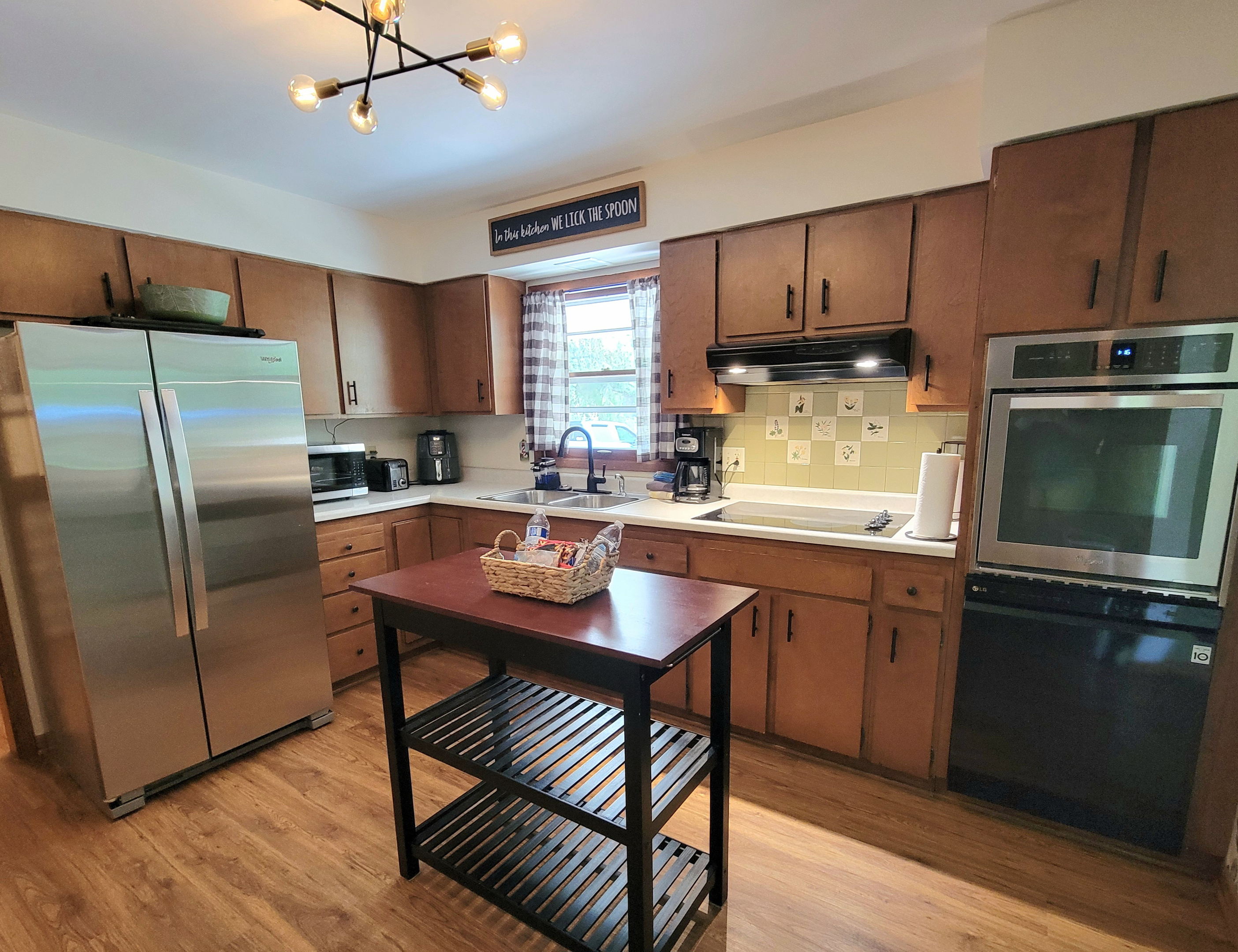 Kitchen: Fully stocked utensils and cookware. Microwave, drip coffee maker, air fryer, oven, stove, dishwasher, microwave