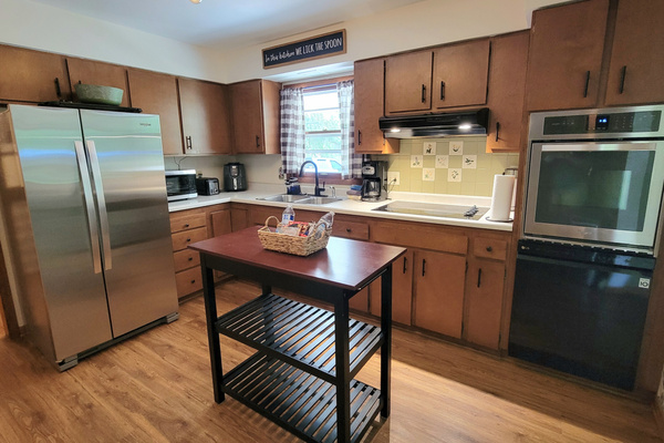 Kitchen: Fully stocked utensils and cookware. Microwave, drip coffee maker, air fryer, oven, stove, dishwasher, microwave