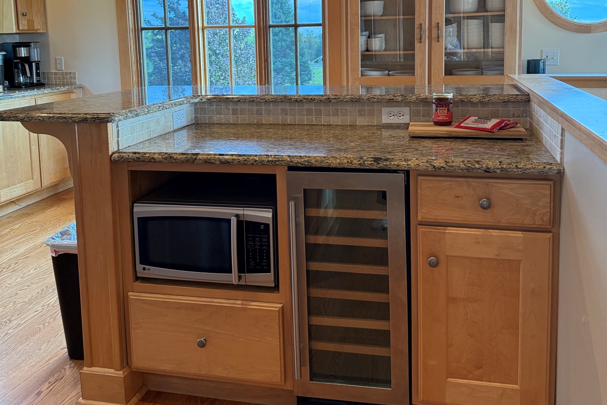 The island seats 3-4 people and also has the microwave, a beverage refrigerator. You will find a blender and toaster in the bottom cabinet.