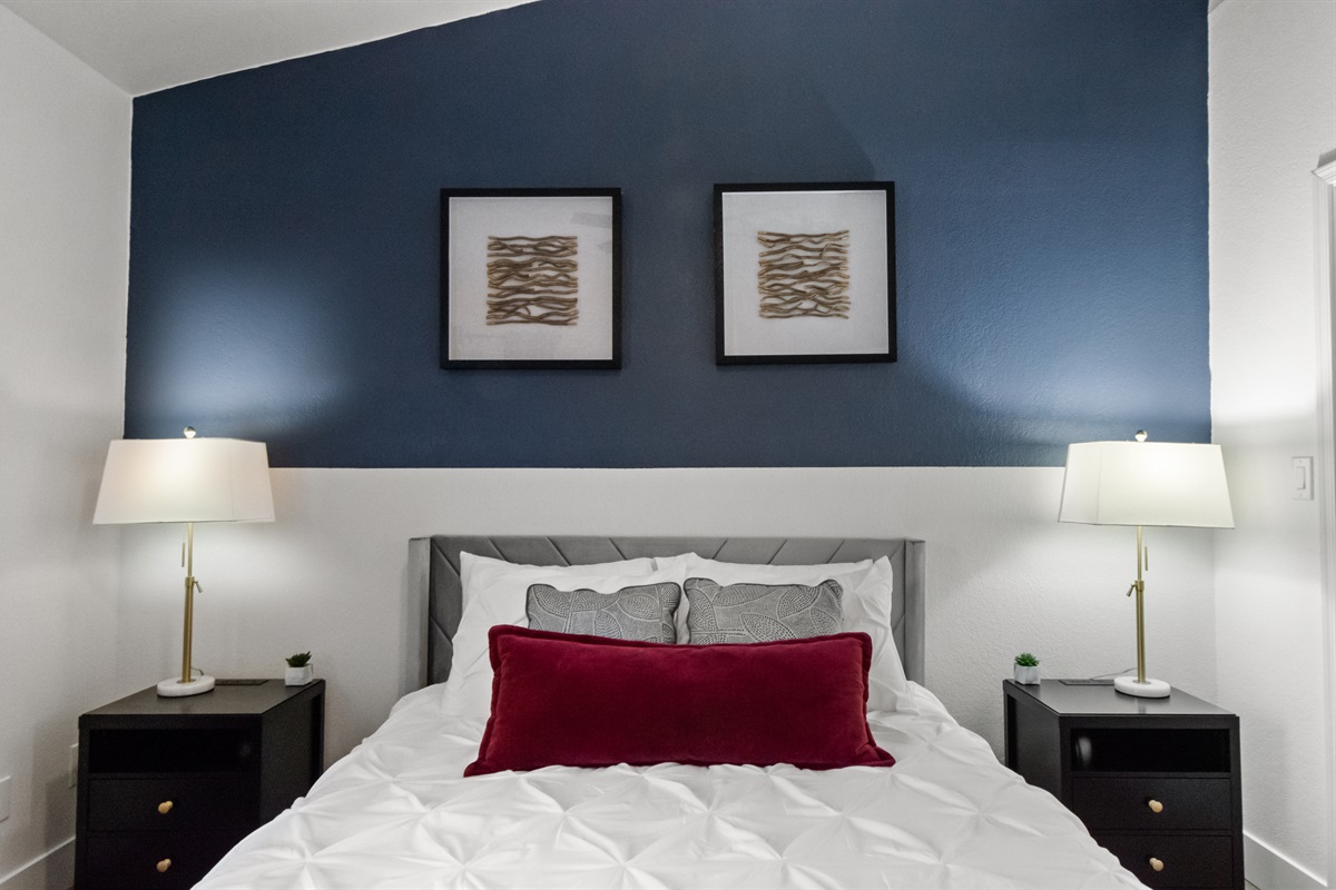 Relax in a clean, modern, and inviting bedroom space