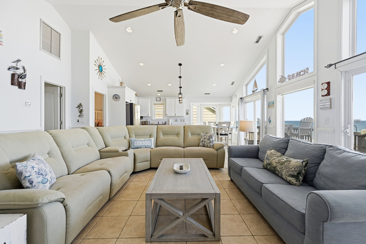 Bright and airy living space designed for effortless group gatherings and coastal relaxation