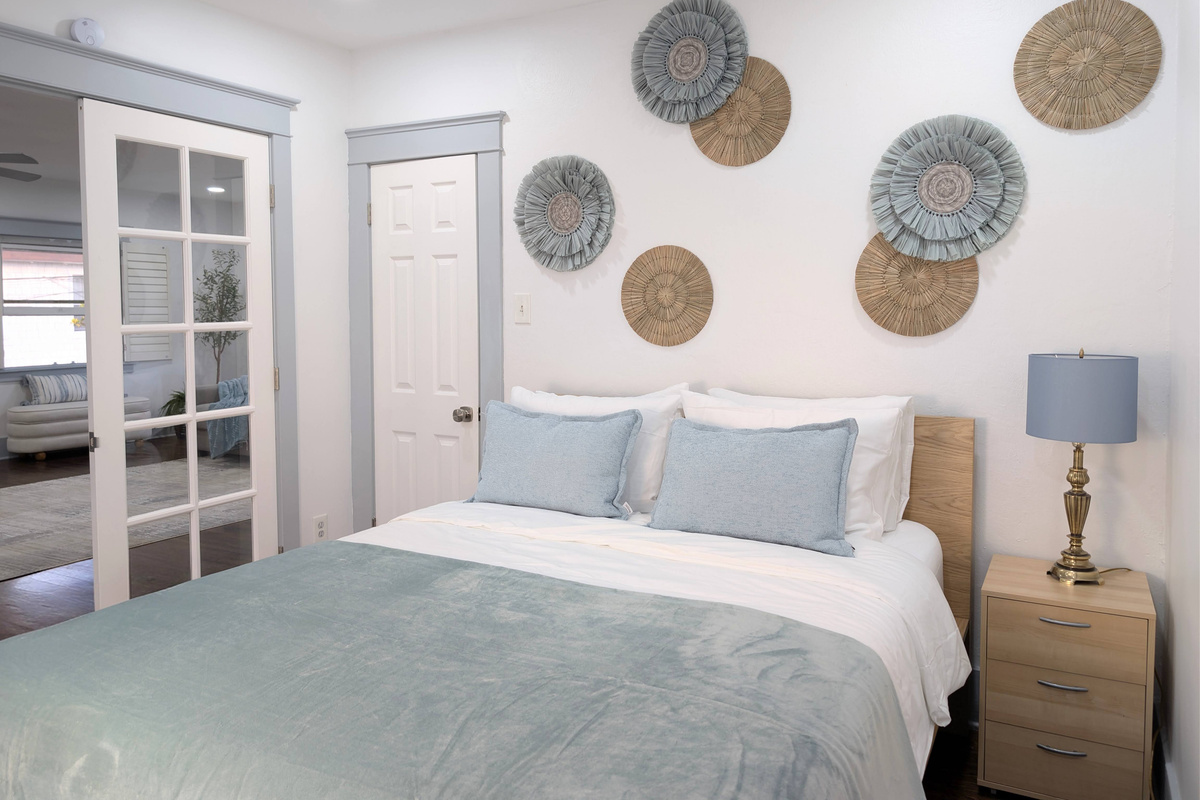 Wake up refreshed in a bright, beautifully designed bedroom where comfort and relaxation come together.