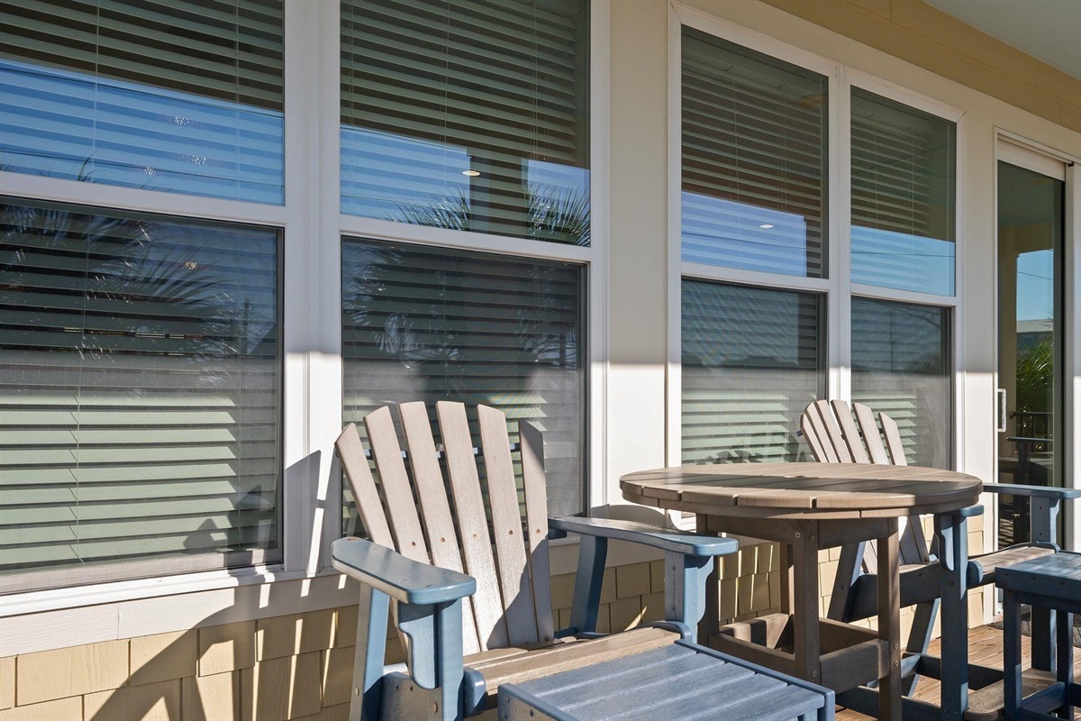Beautiful covered front porch with Gulf views and plenty of seating 