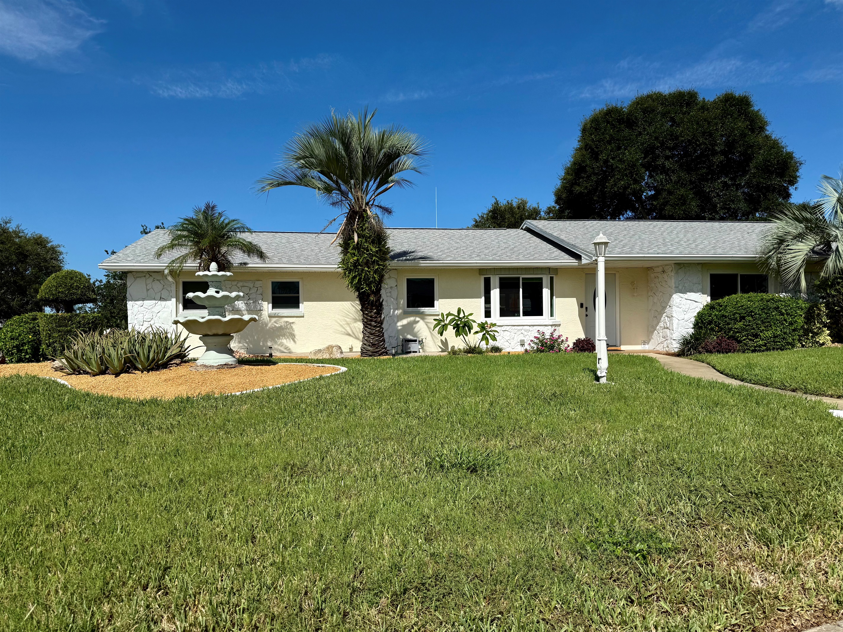 Corner lot. Landscaped and lavish front yard. The house is set back from the street for peace and privacy.