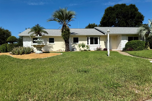 Corner lot. Landscaped and lavish front yard. The house is set back from the street for peace and privacy.