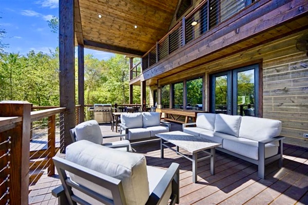 Enjoy multi-level outdoor living—fireside seating, private pond views, and crisp Hochatown air