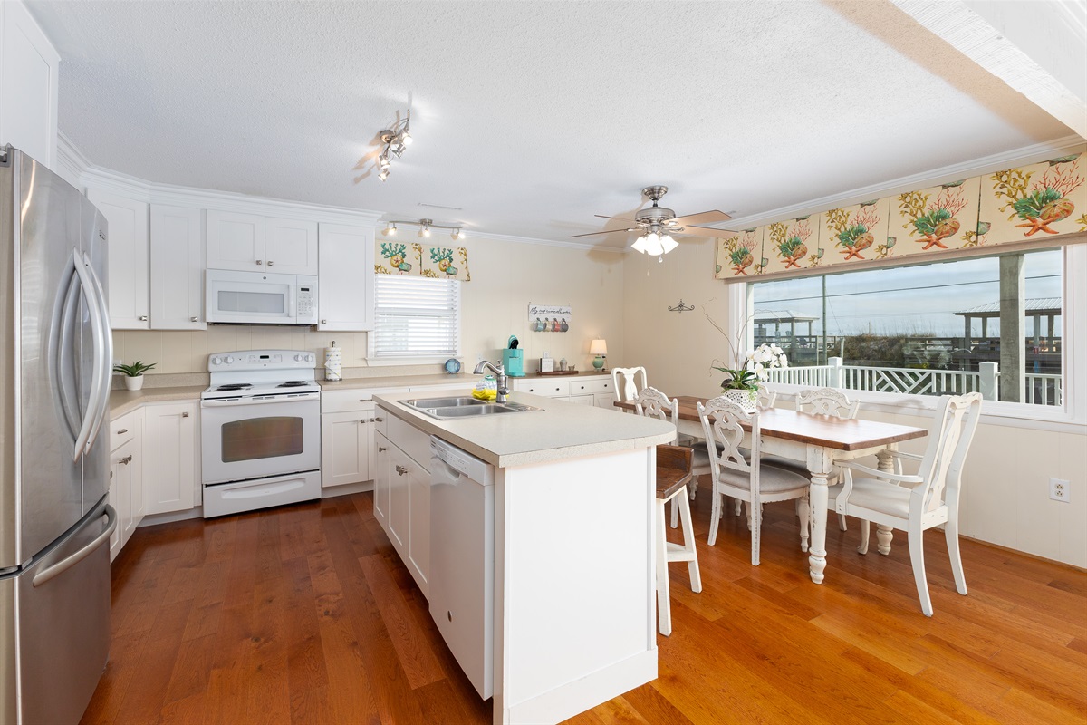 Kitchen and dining area with ocean-view seating