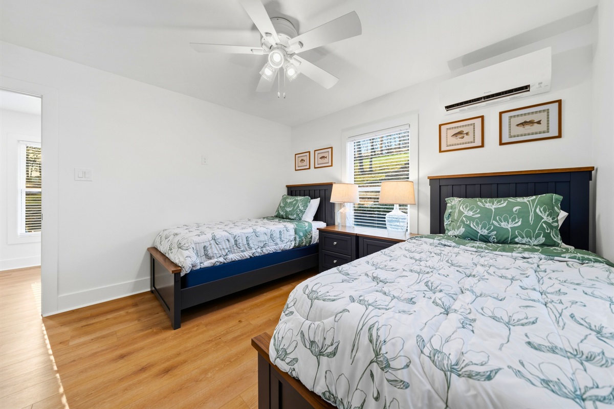 Soft bedding and a simple, relaxed design make this bedroom a comfortable place to wind down at the end of the day.
