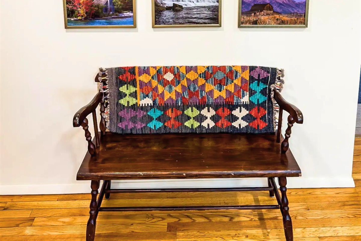 Wooden Bench Seating with Colorful Blanket and Decor