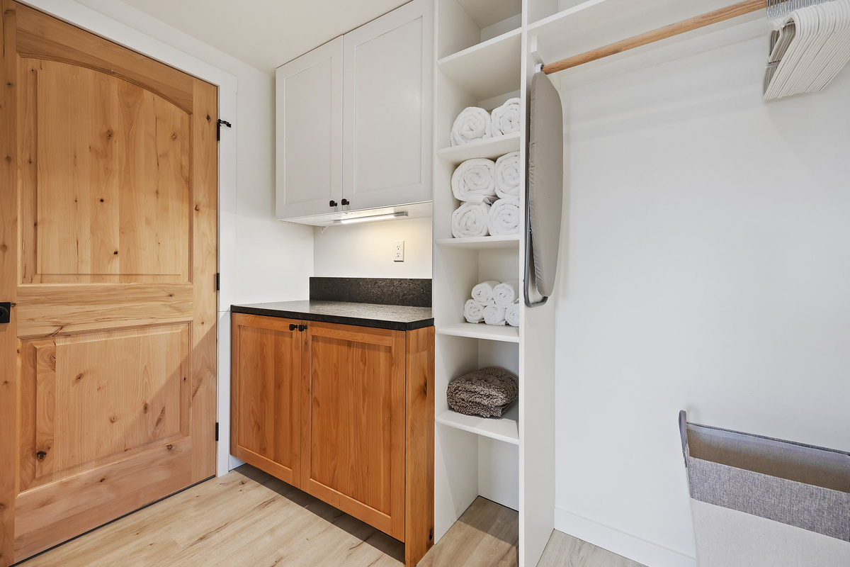 Extra counter and guest storage, stocked with plush towels