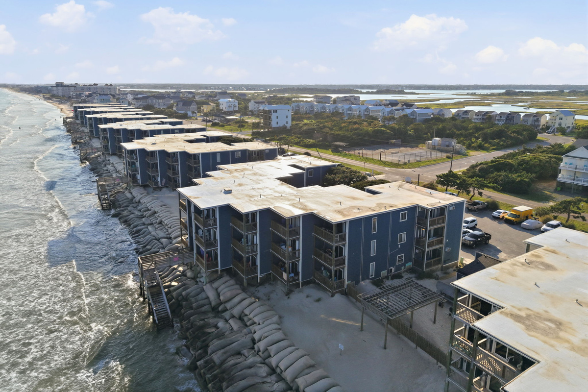 A stunning aerial view of Topsail Reef highlighting its rare oceanfront location, where the buildings sit directly along the Atlantic coastline with endless water views and easy access to the beach