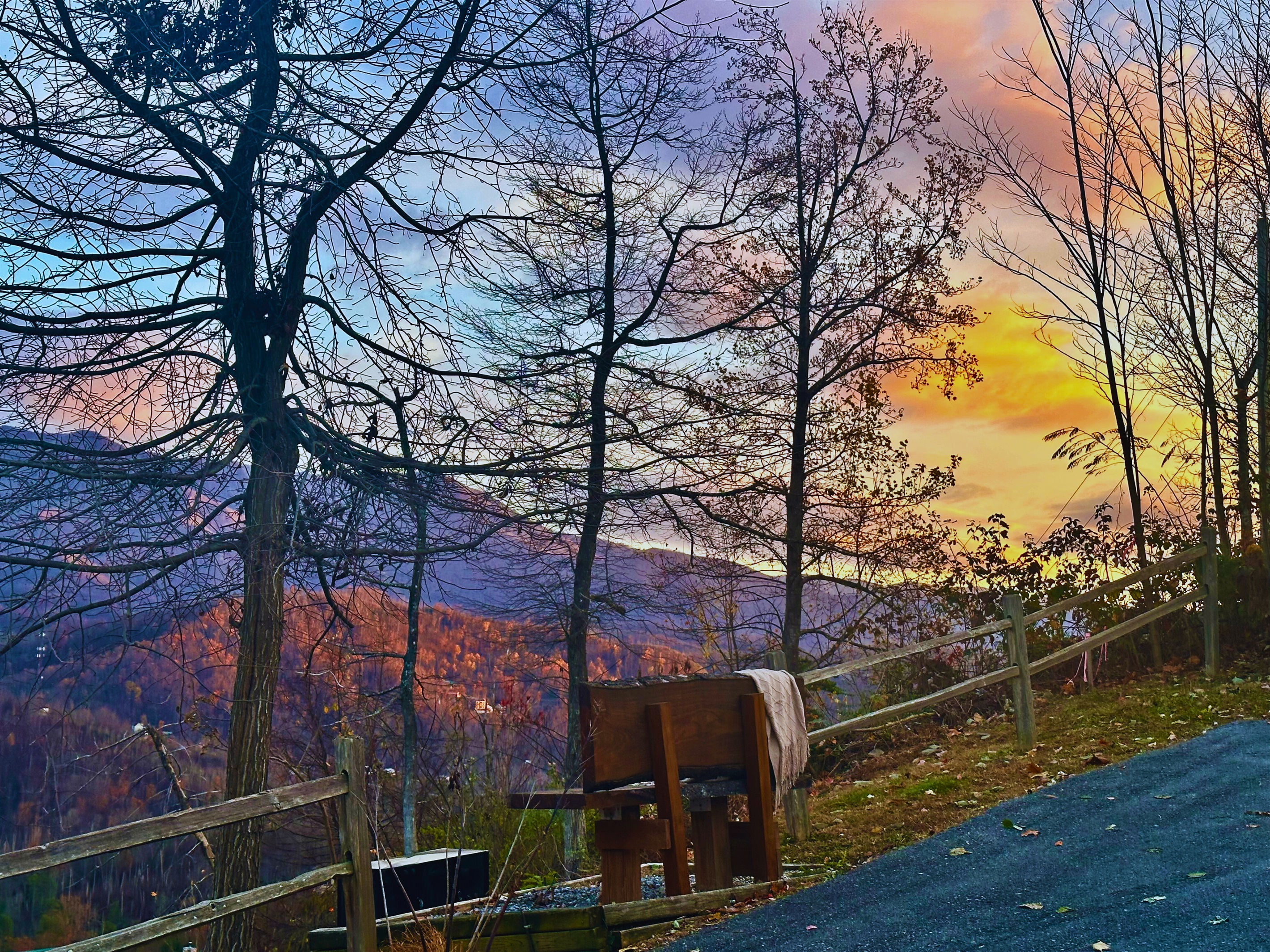 Experience the magic of twilight at Signature Stay, where the fading light creates a peaceful ambiance with stunning mountain views