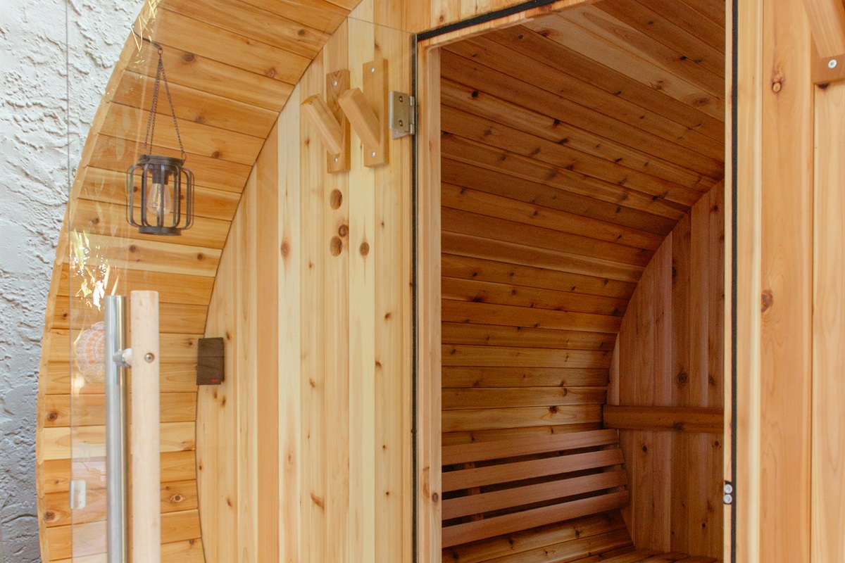 Step into out barrel sauna for a relaxing experience.