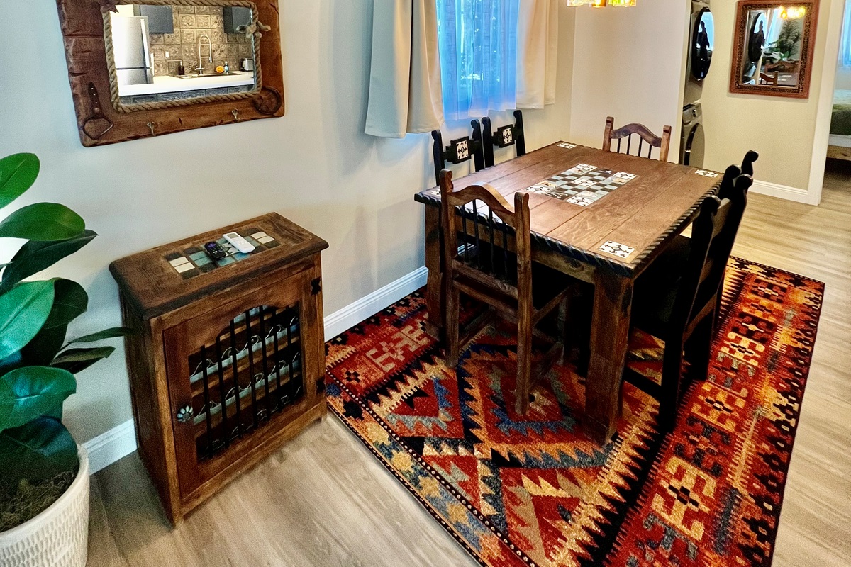 Share a meal at the rustic dining table, featuring stylish pendant lighting