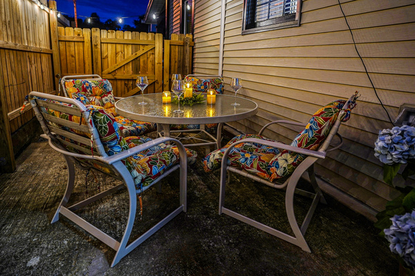 Enjoy a glass of wine or your favorite beverage under the stars by candlelight and with party lights.