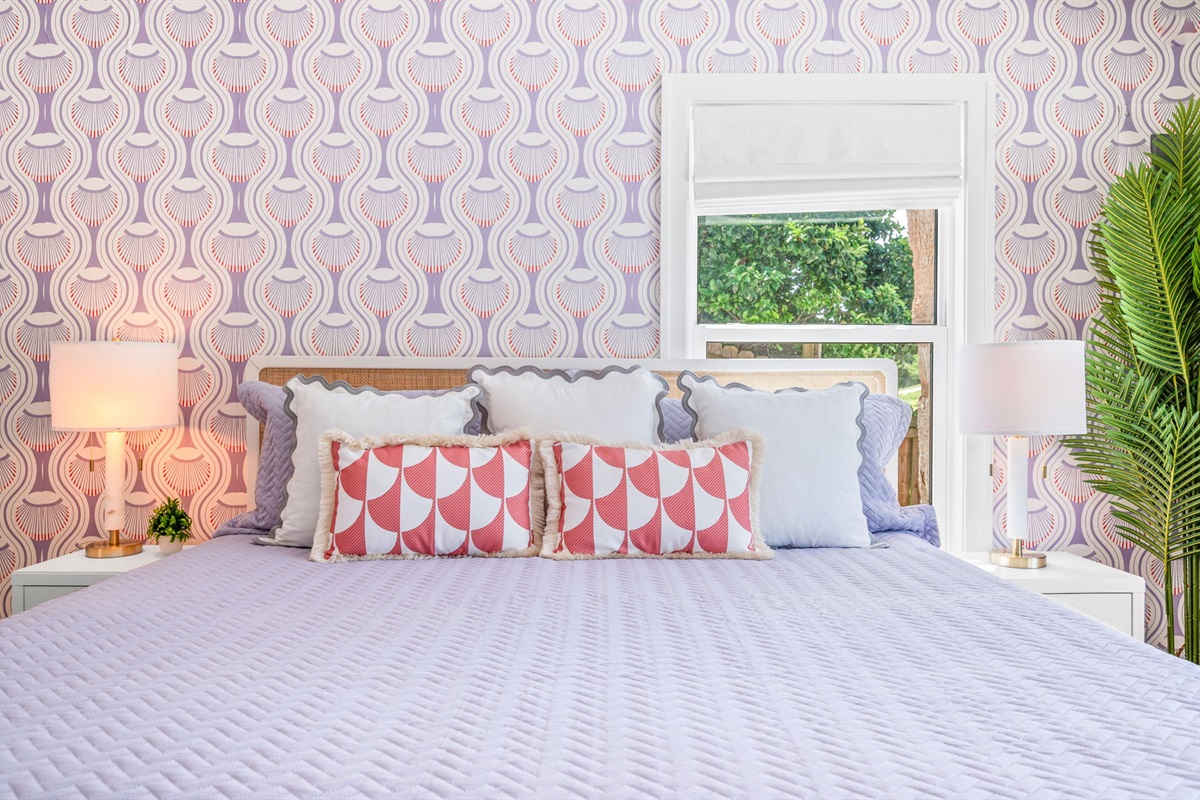 Relax and unwind in our serene downstairs master suite, where vibrant colors meet cozy comfort. Perfect for a restful night, this peaceful retreat offers a refreshing blend of style and relaxation.