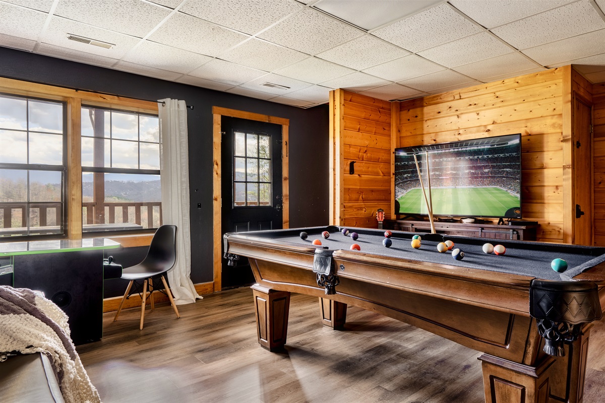 Enjoy a friendly game of pool while catching your favorite shows on the big screen.