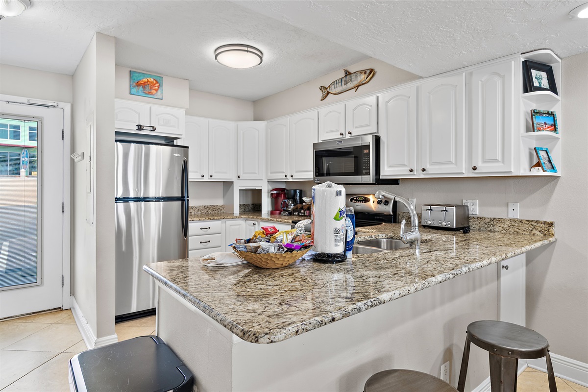 Cook delicious meals in the REMODELED Kitchen while overlooking the Gulf of Mexico