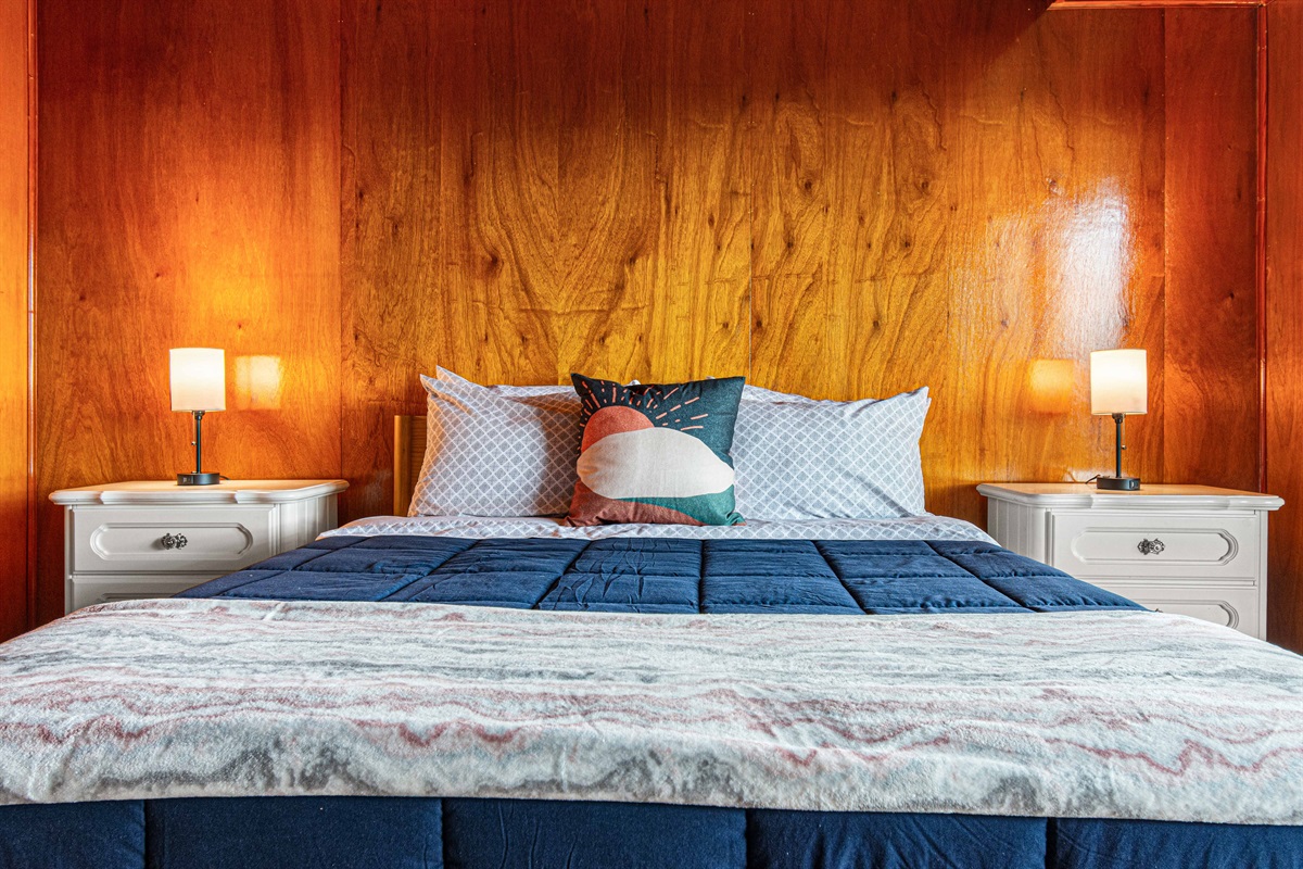 Bedroom Retreat: Serene space with warm wood accents and plush bedding for blissful nights!