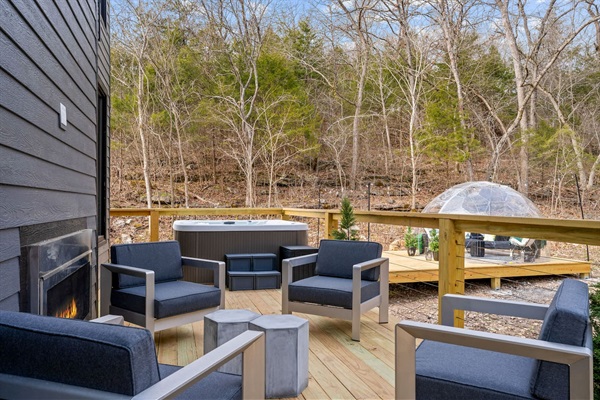 Outdoor Retreat: Unwind on the deck with fireplace, hot tub, and serene forest views!