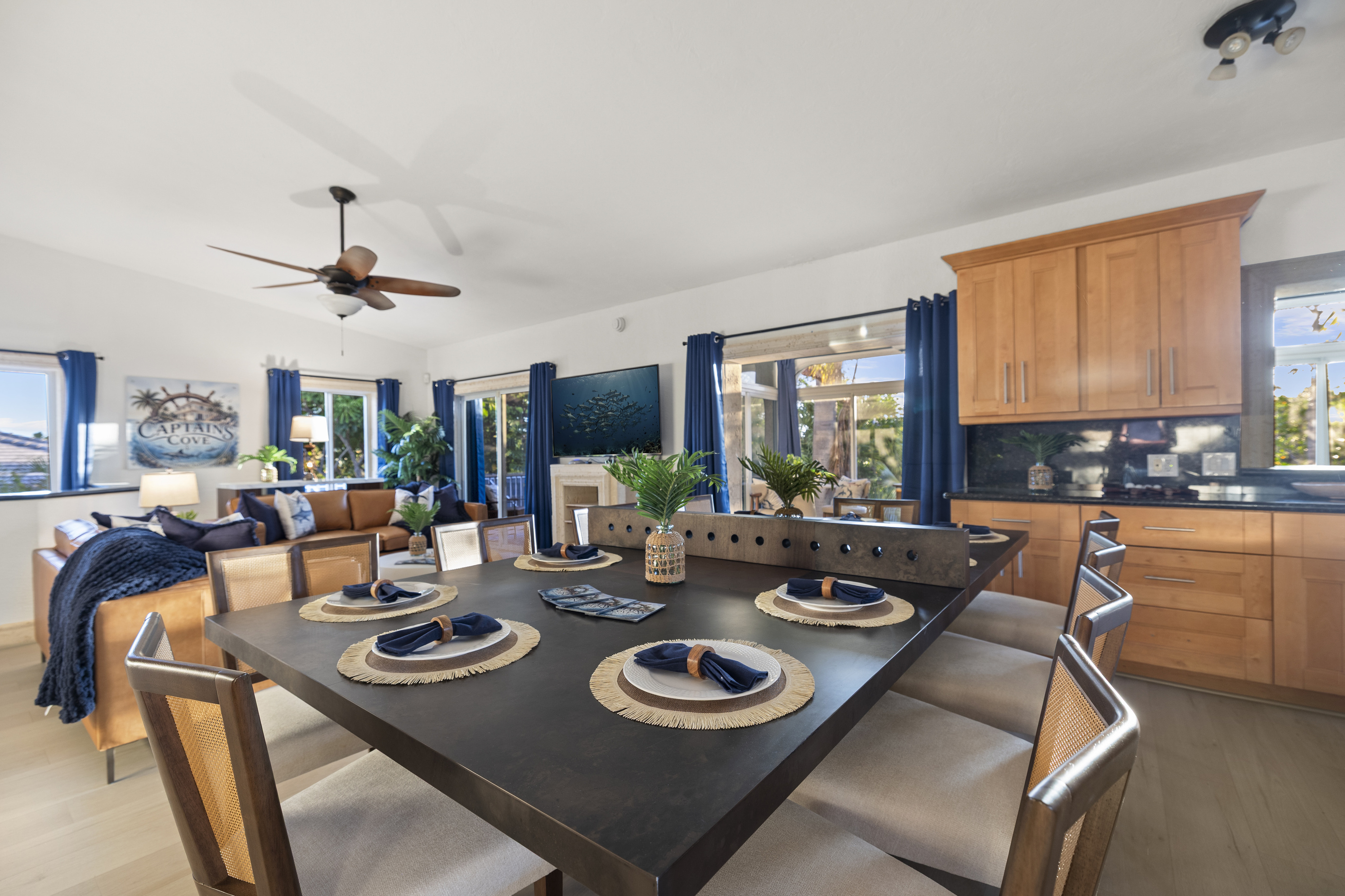 Open layout makes it easy to eat and watch TV, or look out over the lush tropical landscaping.