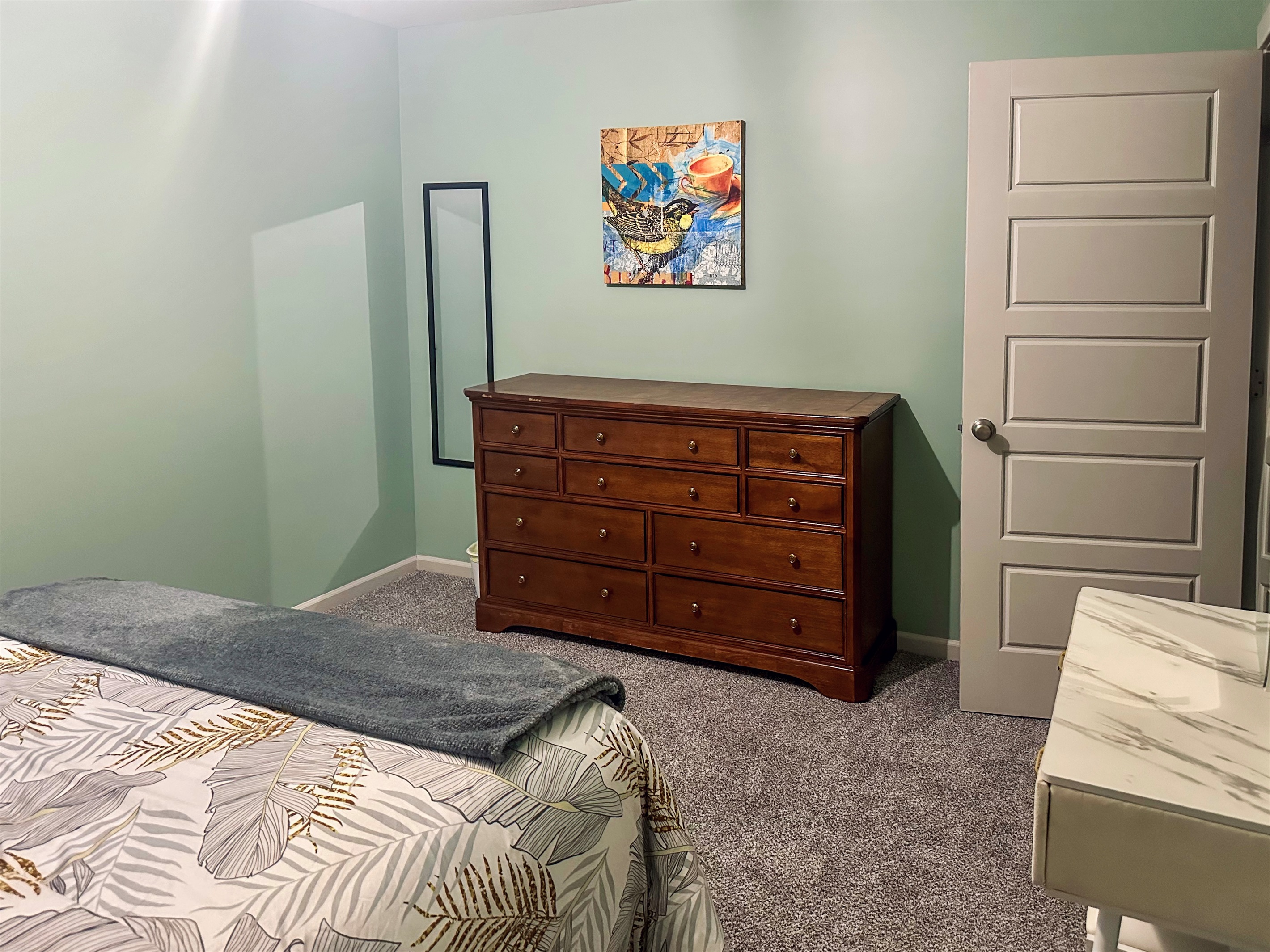 Additional view of the queen bedroom showcasing coordinated furnishings and inviting comfort.