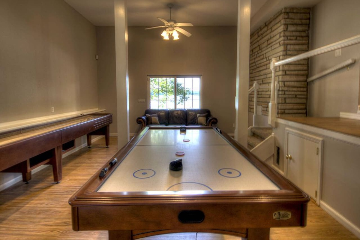 Enjoy playing shuffleboard, air hockey and pool table. Lake view.