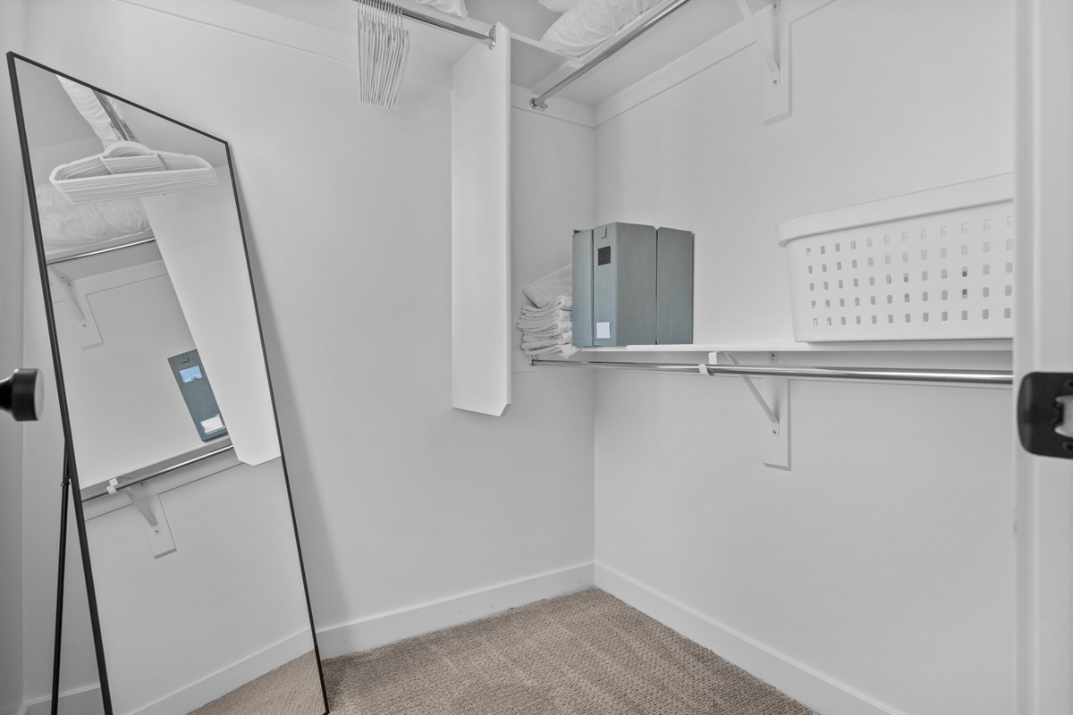 Spacious walk-in closet for storage.