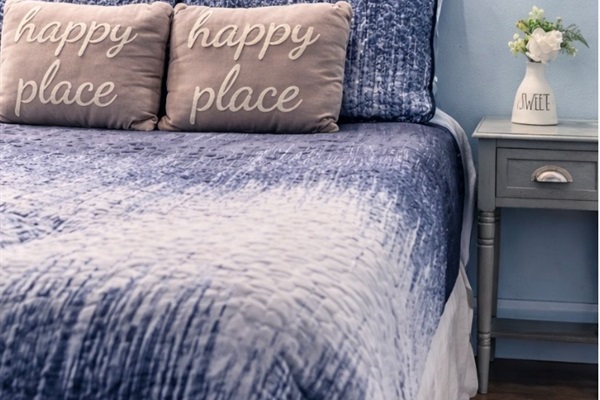 Minimalist bedroom with Soft rattan lighting to set the mood.
A warm, gentle glow complements the calming coastal palette, creating a relaxed, restful atmosphere. The queen bed invites you to unwind, recharge, and ease into peaceful vacation nights