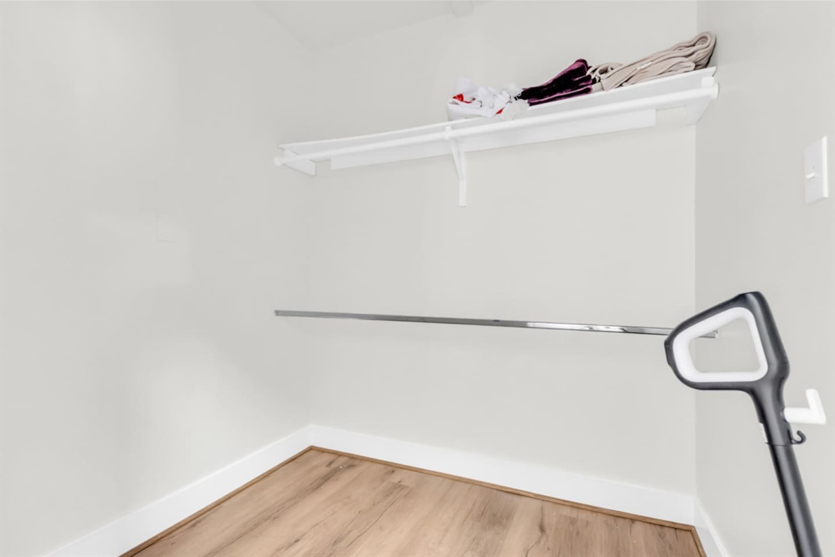 Walk-in closet with ample storage space.