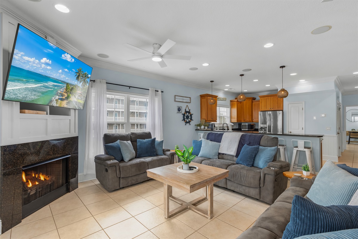 Watch a movie in the comfy living room and enjoy the fireplace in the winter months